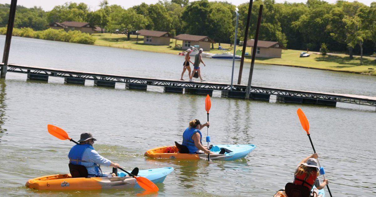 Kayakers paddling out from Hidden Cove Marina on Lewisville Lake